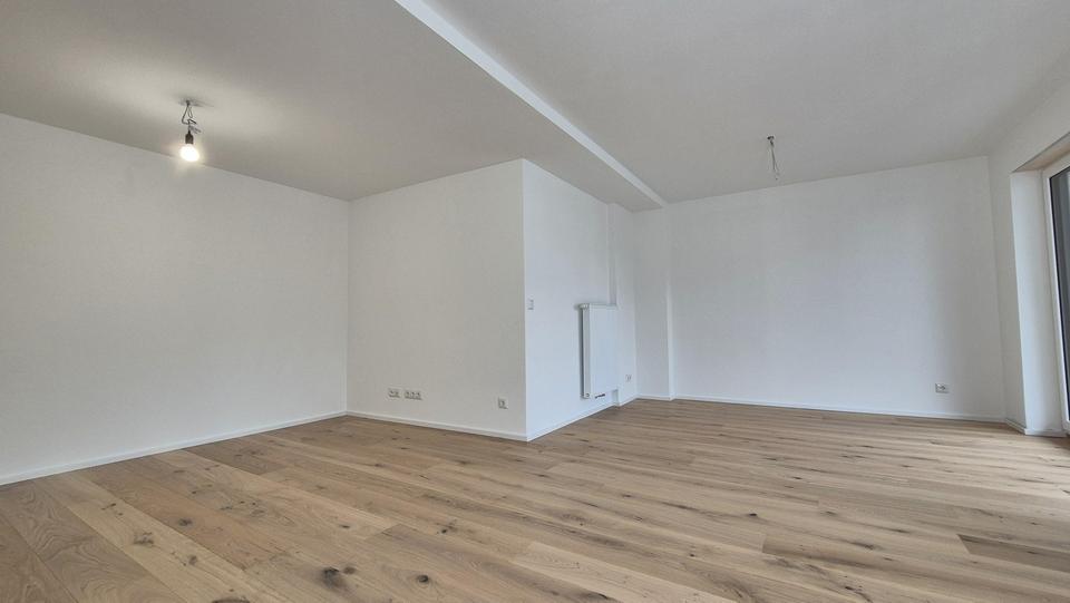 Exklusiver Erstbezug: EG-Wohnung mit wundervollem Erker, riesiger Hochterrasse und Südgarten 3 zimmer