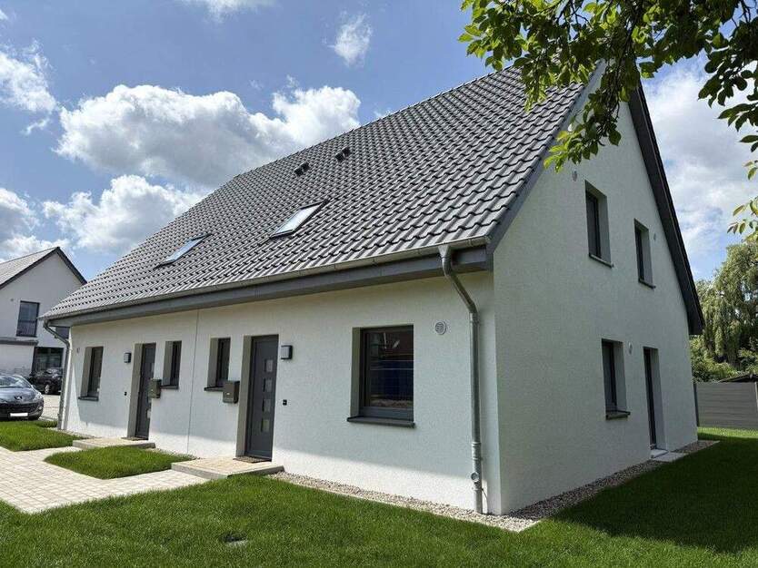 ...Neubau Erstbezug! Attraktive DHH in KfW 55 Standard mit Süd- West Terrassen und Stellplätzen 4 zimmer