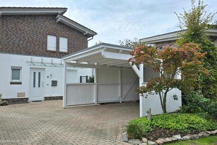 Moderne Maisonette-Wohnung mit Terrasse, Carport und Einbauküche zimmer