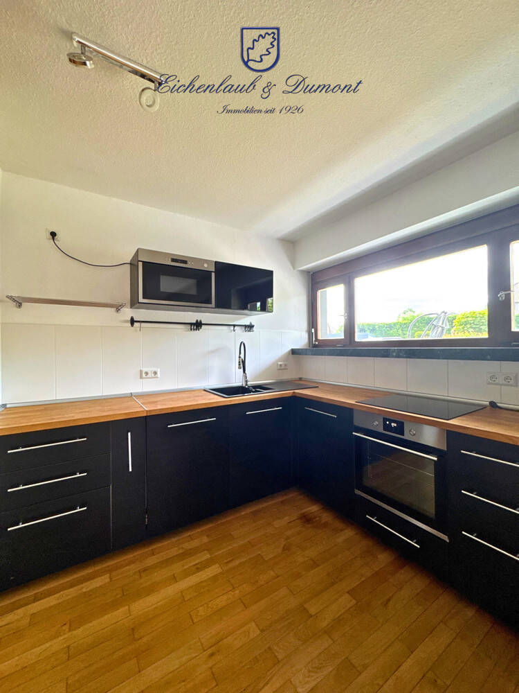 Großzügige Wohnung mit EBK, eigenem Eingang, Garten & 2 Stellplätzen