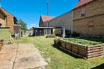 Grundstück 1200 qm mit älterem Wohnhaus und Nebengebäuden
