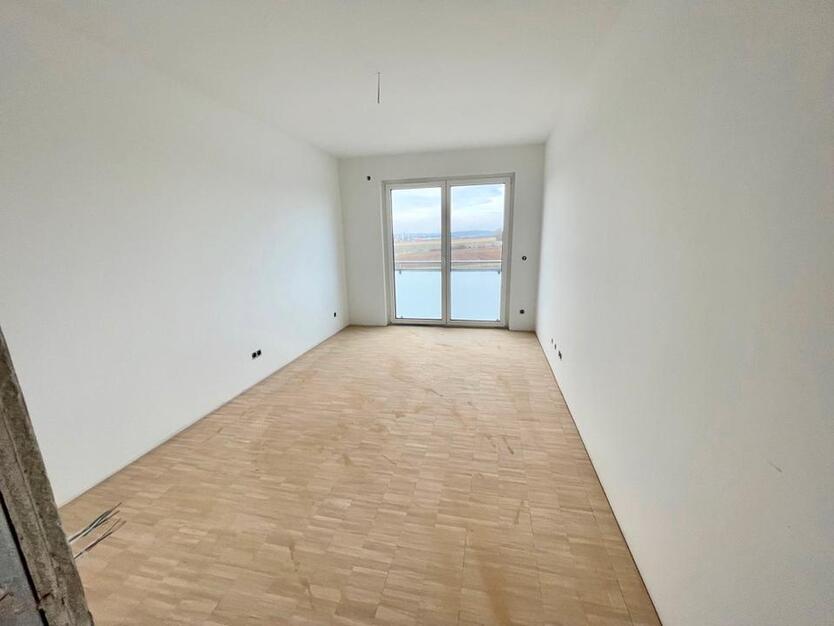 Helle Wohnung BJ 202223 mit Westbalkon, TG-Stellplatz und Stellplatz im Freien!