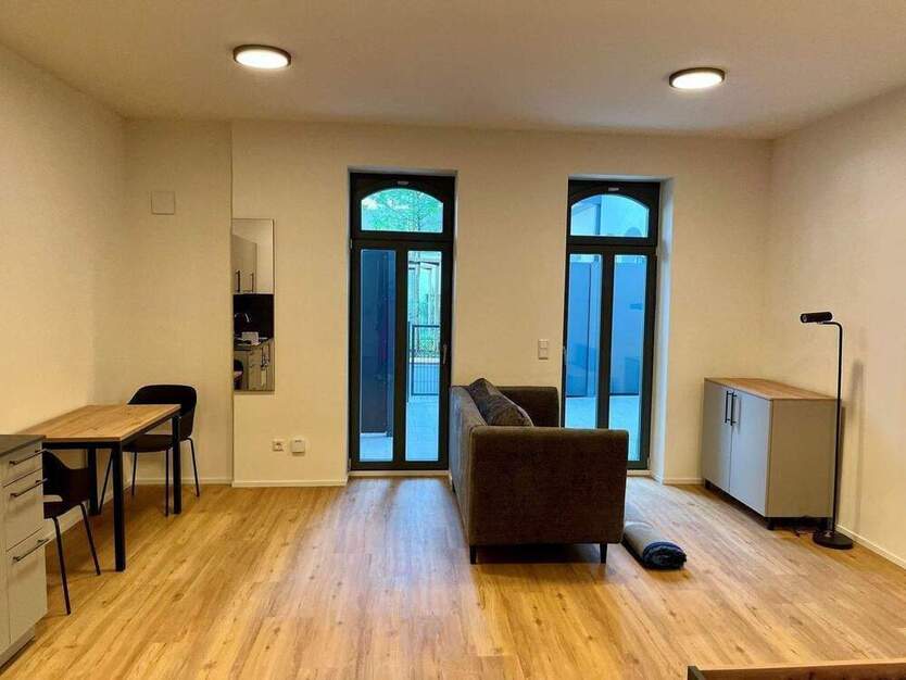 Loftige, möblierte 1-Zimmer-Wohnung mit großer Terrasse zum Erstbezug!