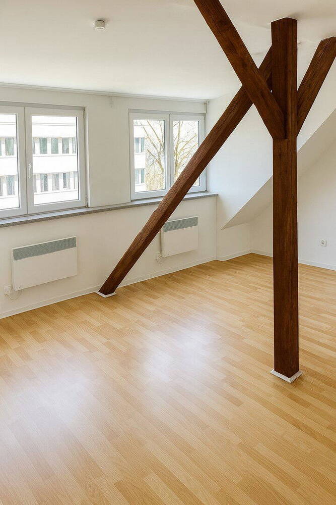 Moderne Dachgeschoßwohnung mit authentischen Sichtbalken - Erstbezug nach Sanierung