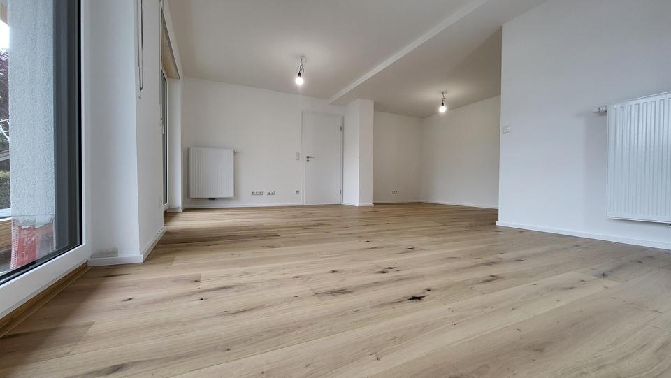 Exklusiver Erstbezug: EG-Wohnung mit wundervollem Erker, riesiger Hochterrasse und Südgarten 3 zimmer